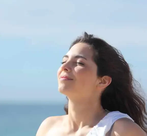 calm and relaxed woman in the sunshine