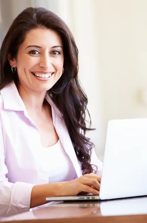 Happy relaxed woman with laptop